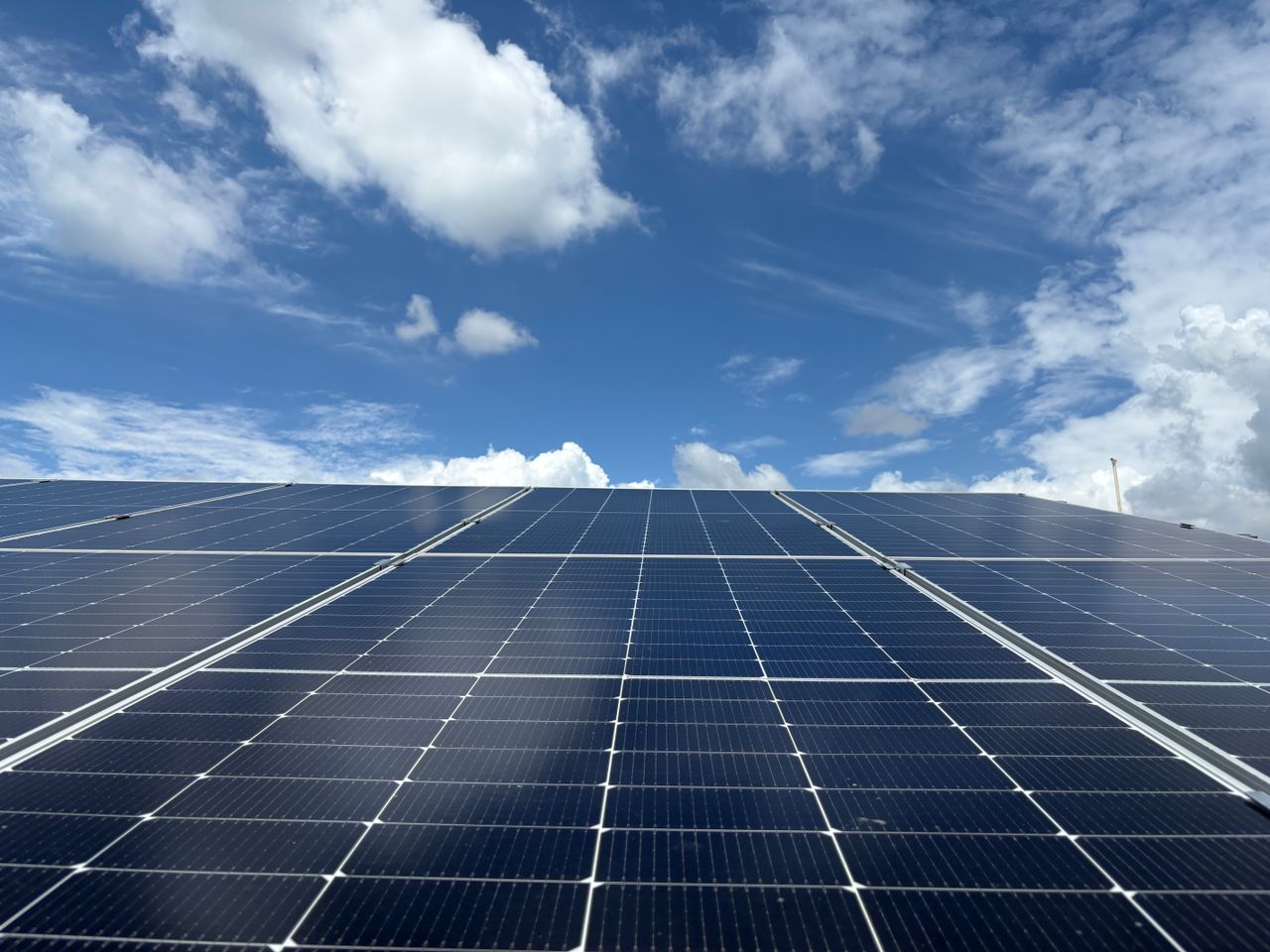 Mastering the First Impression: Your intriguing post title goes here Solar panels generating renewable energy beneath a clear blue sky in Dehradun, India.
